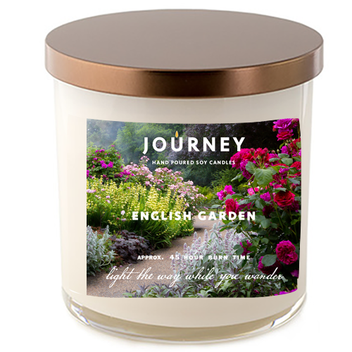 Journey Candle's English Garden soy wax candle in a glass tumbler style jar. The label features an English garden with roses, lavender and other flowers in full-bloom.
